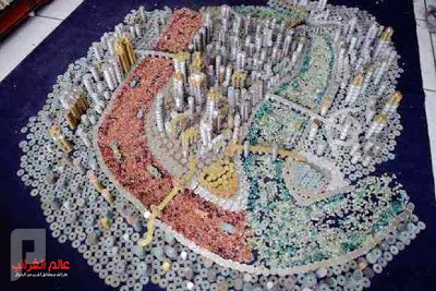 فنان صيني يصمم مدينة بواسطة القطع النقدية