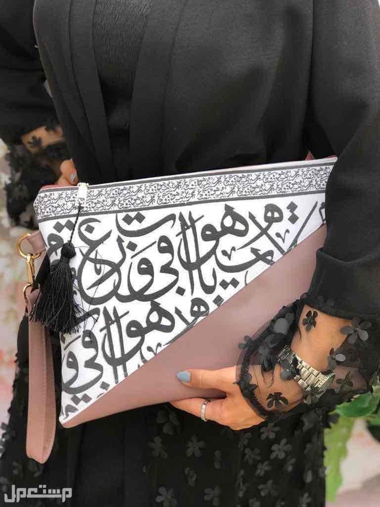شنط يد باوتش جلد حروف عربية