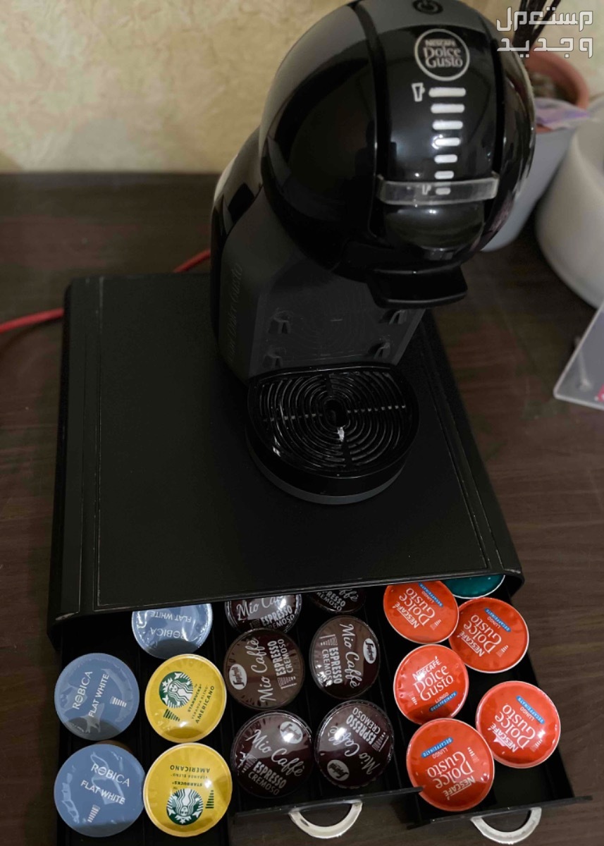 آلة قهوة مع درج كبسولات من دولتشي شبه جديدة