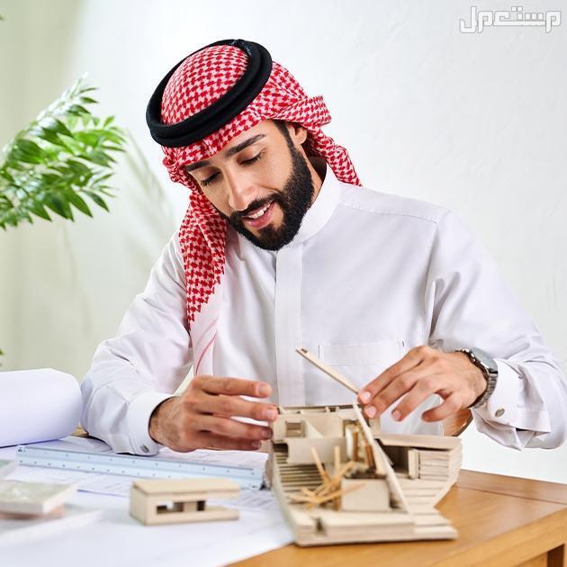 شروط التمويل العقاري 1446 دليل شامل شاب يصنع شقة من الورق المقوى