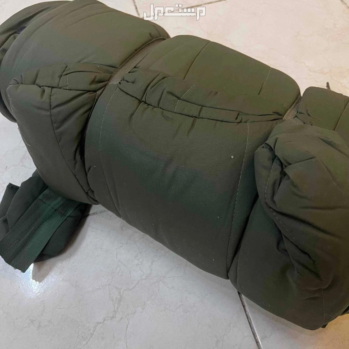 قفازات ومطاره ماء وكيس نوم للبيع تبوك